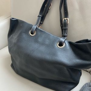 Dooney and Bourke large Black Leather tote with adjustable straps.